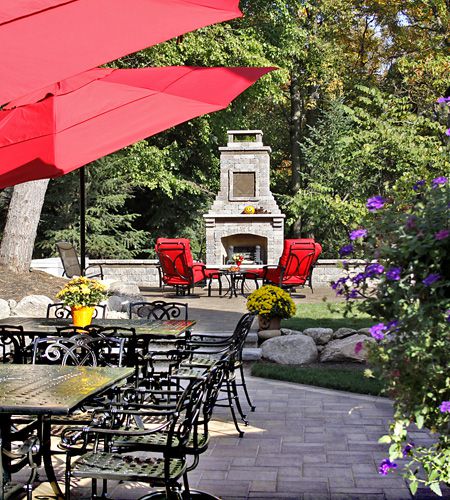 Patio and outdoor fireplace by Serenescapes